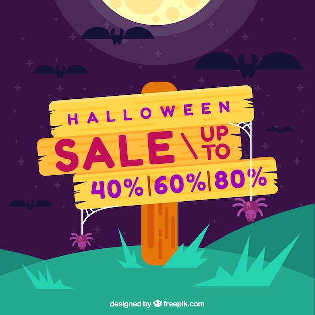 Halloween sale background with wooden sign Free Vector