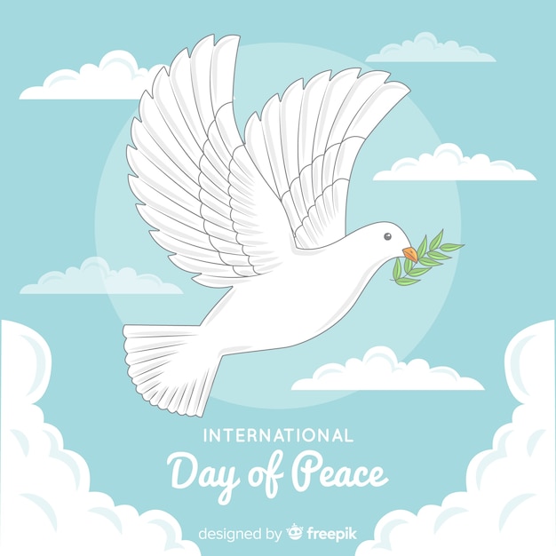 鳩とオリーブの葉で手描きの平和の日 無料のベクター