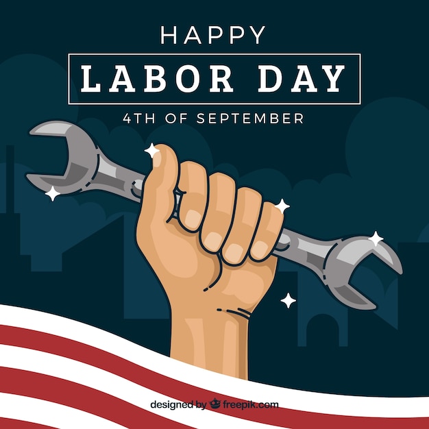 Hand holding wrench as symbol of labor day Vector | Free Download