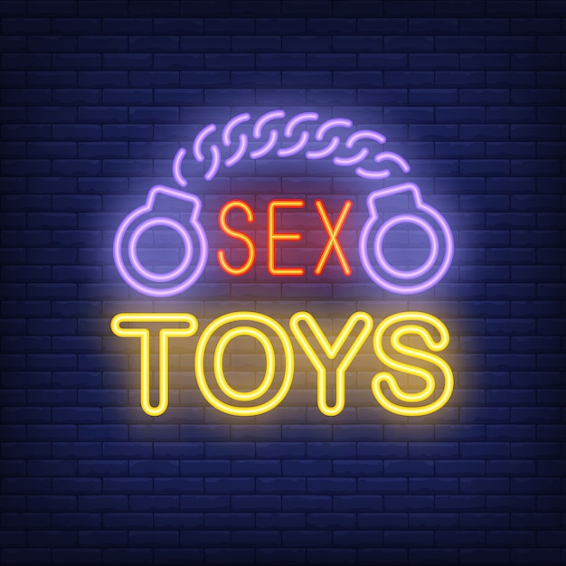 Handcuffs With Sex Toys Lettering Neon Sign On Brick