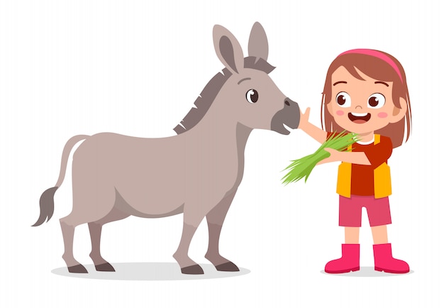 Happy cute kid girl feeding cute donkey Premium Vector