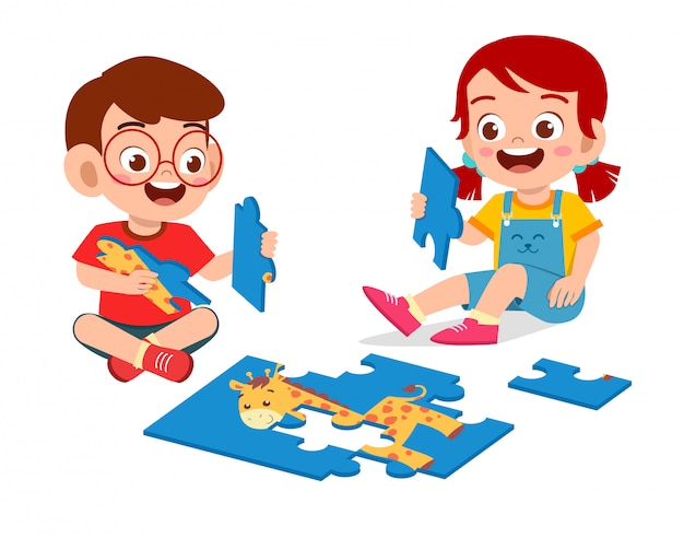 Happy cute little kid boy and girl play jigsaw puzzle | Premium Vector