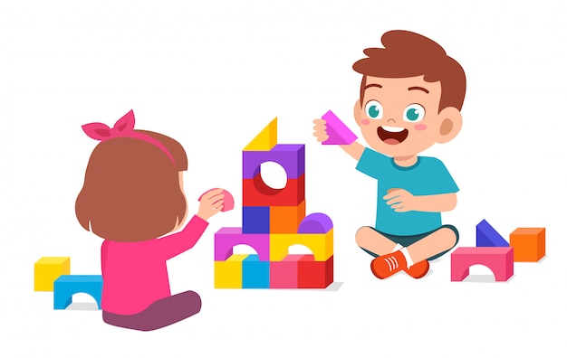 Happy cute little kid boy and girl play together Premium Vector
