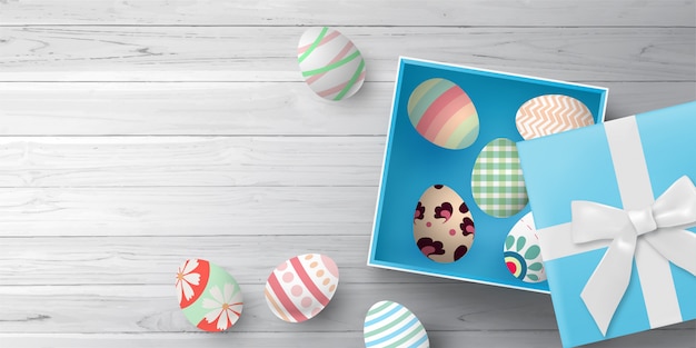 happy easter background with easter eggs gift box white wooden table from top view space 146764 83