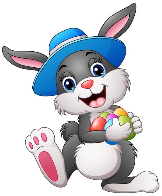 Download Happy easter bunny wearing a hat carrying eggs | Premium ...