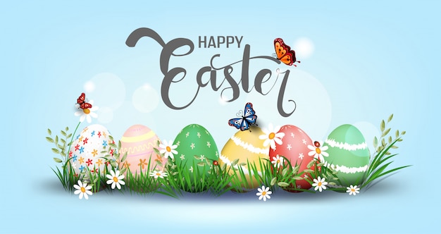 Happy easter element for design. eggs in green grass with white flowers isolated Premium Vector