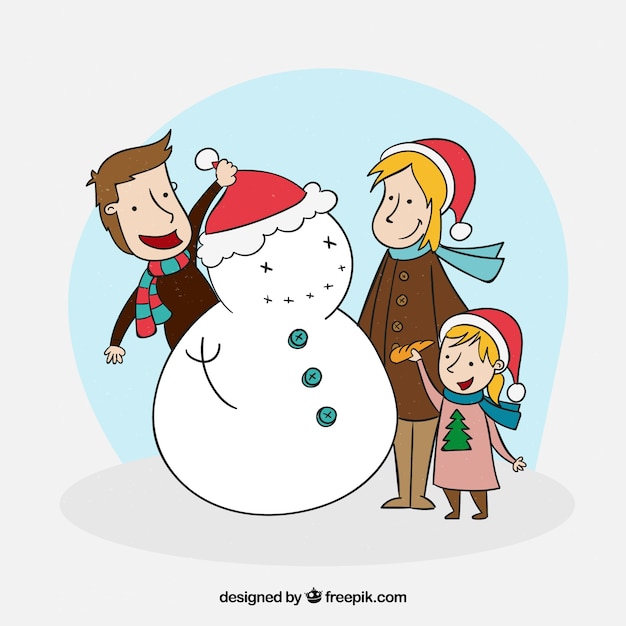 Download Happy family building a snowman | Free Vector