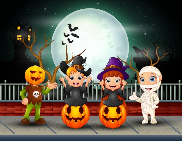 Premium Vector | Happy halloween kids in full moon background