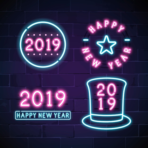 Happy new year 2019 neon sign vector set Free Vector