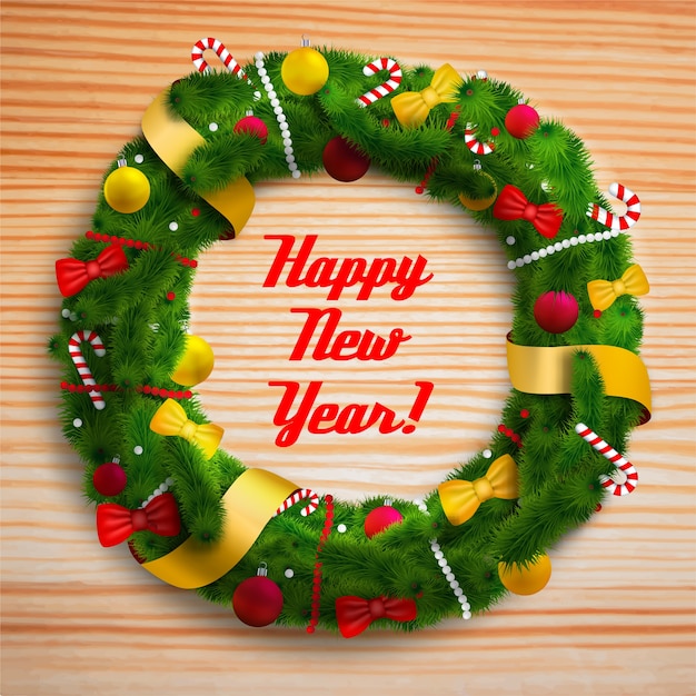 Free Vector | Happy new year decorated wreath on wooden table