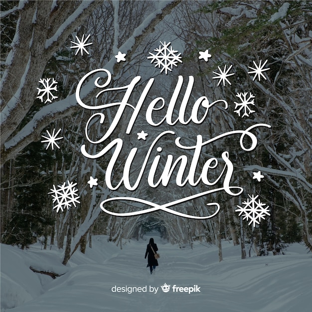 Download Hello winter lettering with forest and snow Vector | Free ...