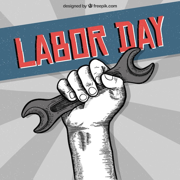Labor day background with hand holding\
tool