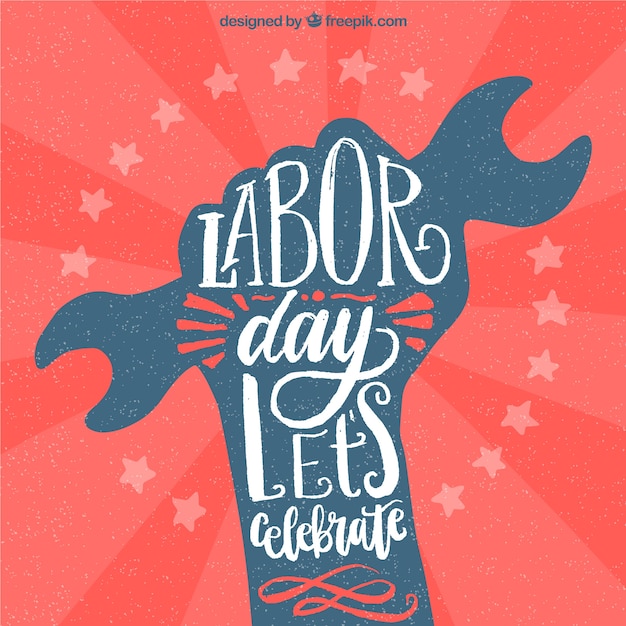 Labor day background with hand holding\
tool