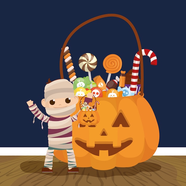 Download Little boy with mummy disguise and candies pumpkin Vector | Free Download