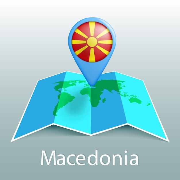 灰色の背景に国の名前とピンでマケドニアの旗の世界地図 プレミアムベクター