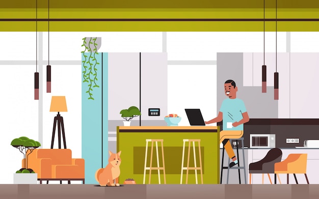 Premium Vector | Man freelancer using laptop working at home during ...