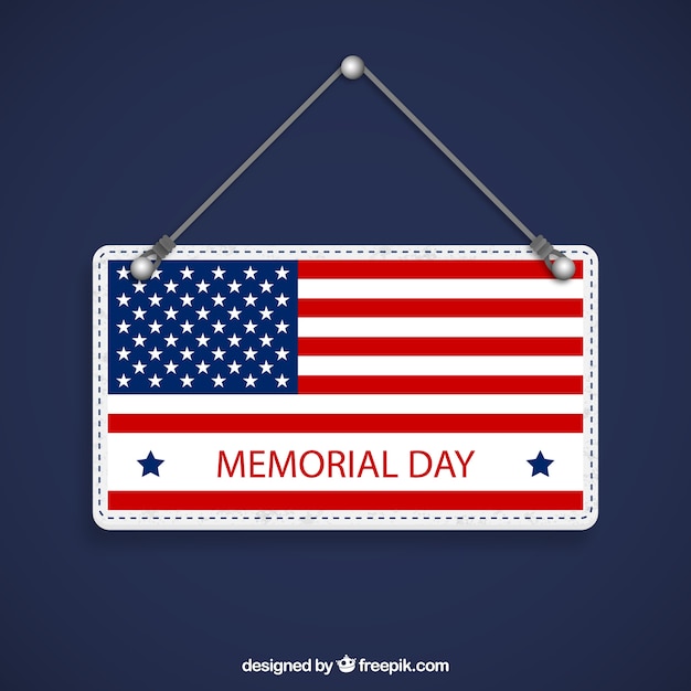 Memorial day sign hanging on a rope