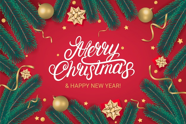 ゴールデンクリスマスボール クリスマスツリーの枝 ギフトとメリークリスマス手書きレタリングテキスト 赤の背景 リアルなスタイル ベクトルイラスト プレミアムベクター