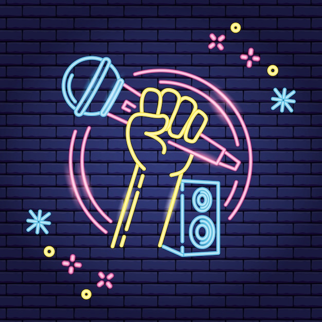 Microphone and speaker in neon style over purple Free Vector