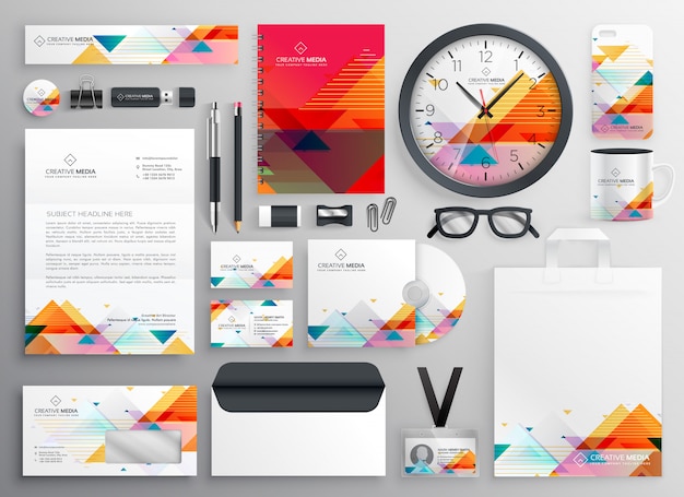 Modern set of brand stationery items with abstract shapes Free Vector