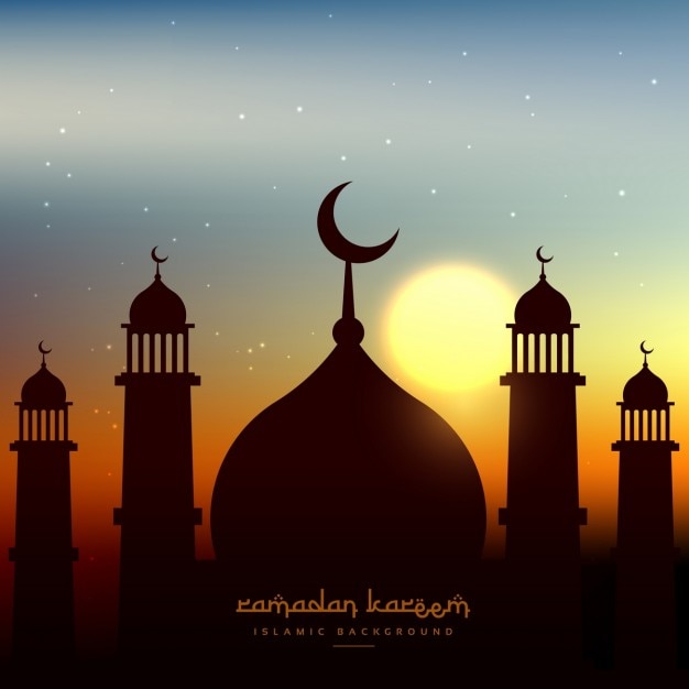 Mosque silhouette in evening sky with\
sun