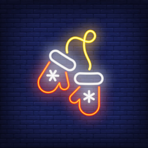 Neon christmas mittens with snowflakes. night bright advertisement element. Free Vector