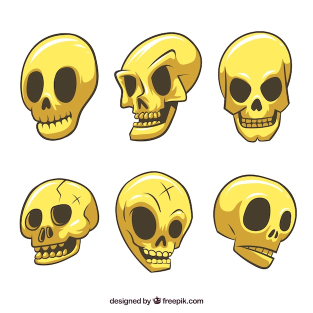 Pack of hand drawn yellow skulls | Free Vector