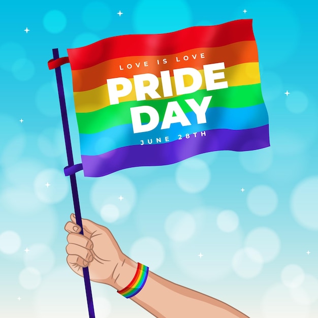 Free Vector | Pride day hand holding flag