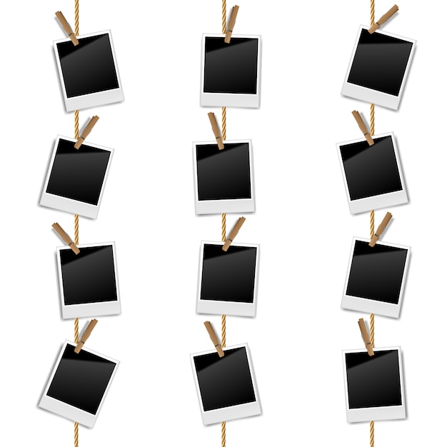 Realistic blank retro photo frames on a rope with wooden clips, vector illustration Premium Vector