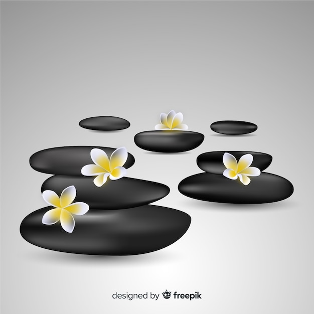 Realistic spa stones with flowers | Free Vector