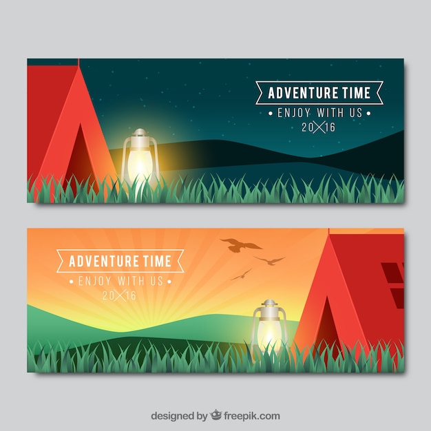 Red camping tent with grass banners