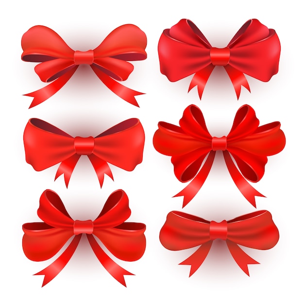 Premium Vector | Red gift bows with ribbons