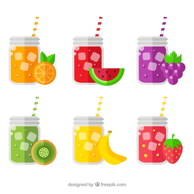 Selection of six glasses with fruit juices and\
straws