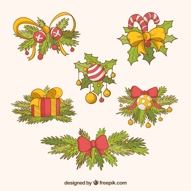 Free Vector | Set of christmas ornaments with hand-drawn leaves