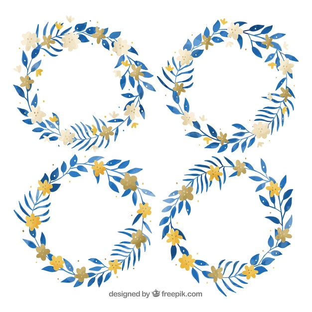 Set of four winter wreaths in blue and\
yellow