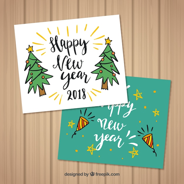 Free Vector | Set of two hand drawn new year greeting cards