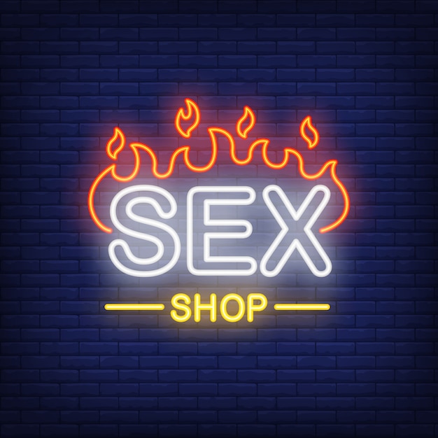 Sex shop lettering on fire. neon sign on brick background ...