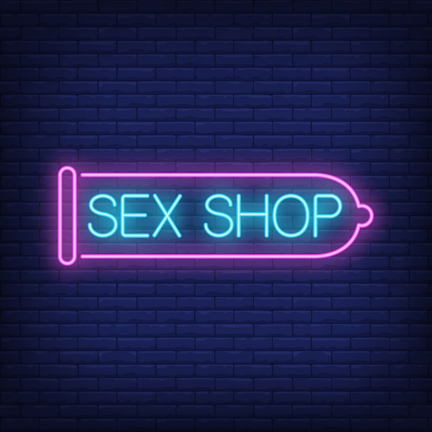 Sex Shop Neon Sign Pink Condom On Brick Wall Night Bright Advertisement Premium Vector