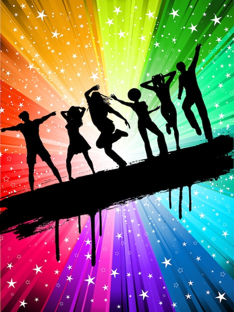 Silhouettes of people dancing on a starry multi
coloured background