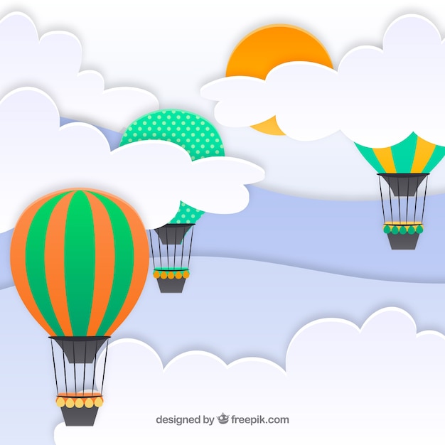 Sky with clouds and hot air balloons flying\
background in paper texture