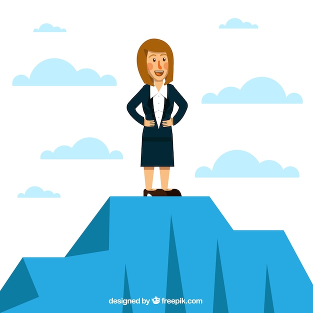 Smiling businesswoman on the top of a
mountain