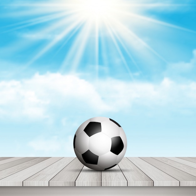 Soccer ball on table against blue sky