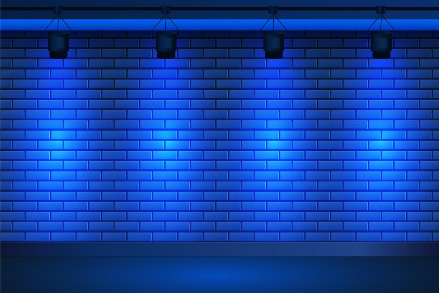 Free Vector | Spot lights on blue brick wall background