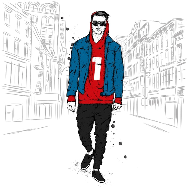 Stylish guy in fashionable clothes on a city street. Premium Vector