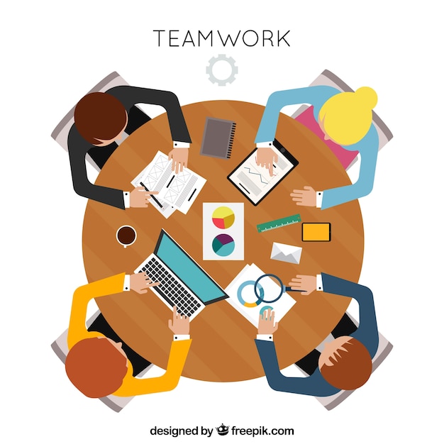 Teamwork concept with top view of round
desk
