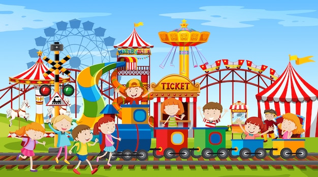 Themepark scene with many rides and happy children | Free Vector