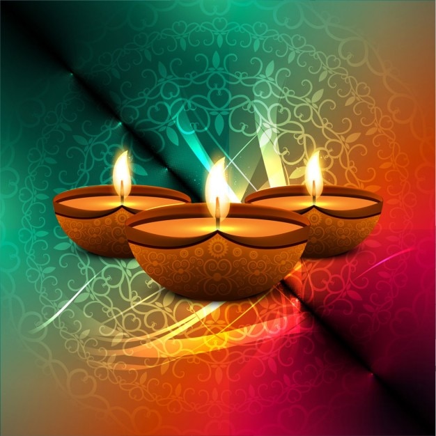 Free Vector | Three candles on a colorful background for diwali