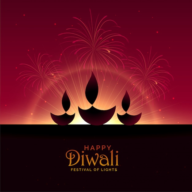 Three diwali diya with fireworks