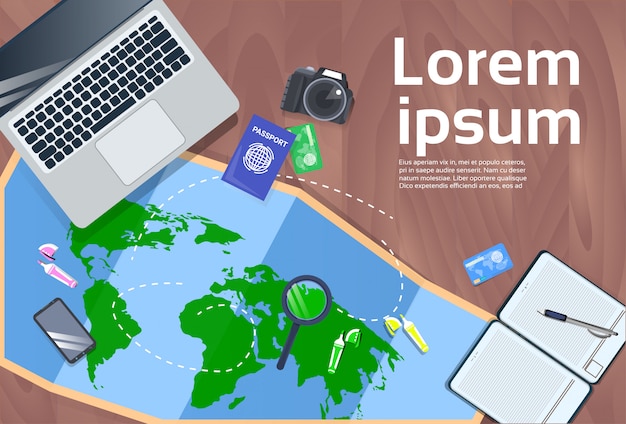Vacation planning and travel concept desktop with laptop, map, photo camera and passport top view Premium Vector