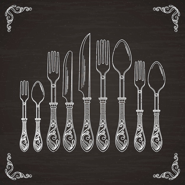 スプーン フォーク ナイフのベクター画像 黒い黒板に食器手描きのシルエット プレミアムベクター